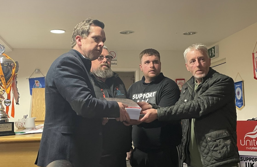 Tom being handed the Unite the Union petition regarding calls for support for the steel industry by three representatives from the Union.