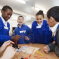 An image showing a group of primary school students enjoying getting involved in a STEM activity.